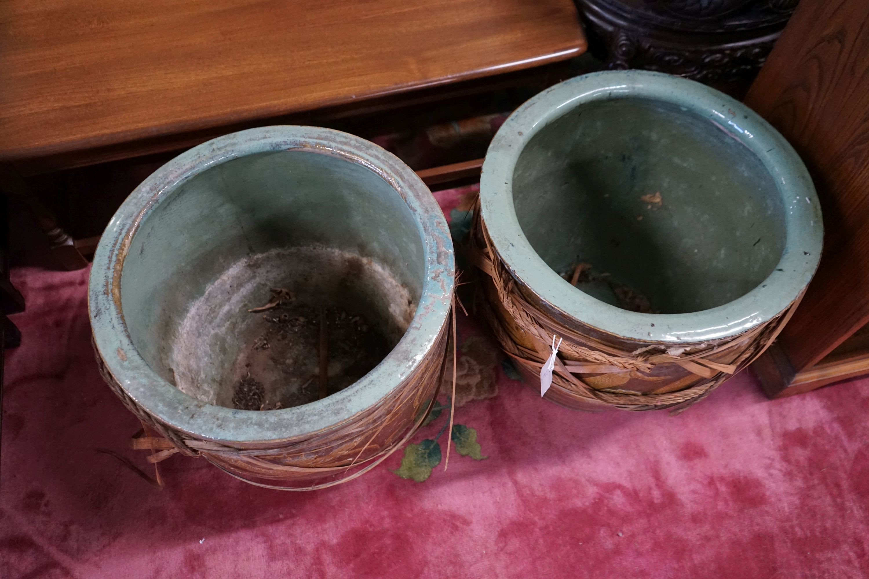 A pair of Chinese glazed earthenware dragon planters, diameter 50cm, height 47cm